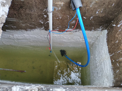 interior of water
tank with walls bright and new, water level sensors and pipe to pump