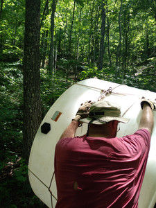 Joey from the back as he rolls water
tank up a forested hill